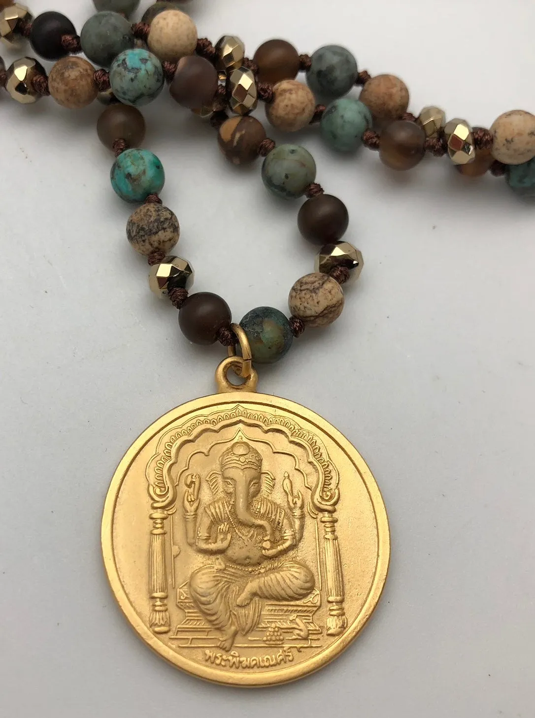 Bhakti Panda Joyful Beginnings Gold Ganesh Pendant on Lapis Necklace