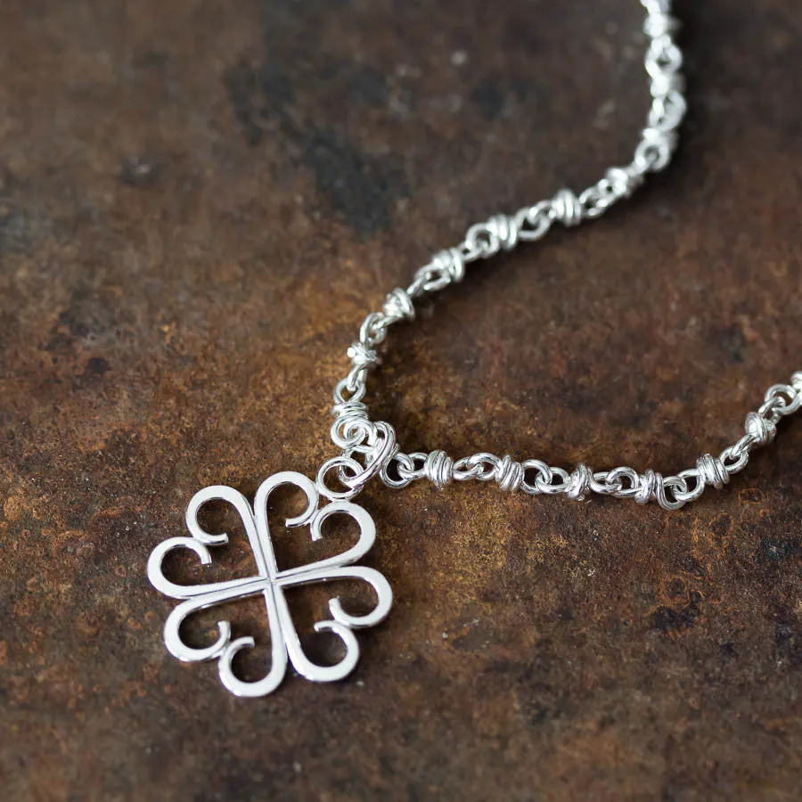 Good Luck Pendant, Small Four Leaf Clover Made of Silver Hearts