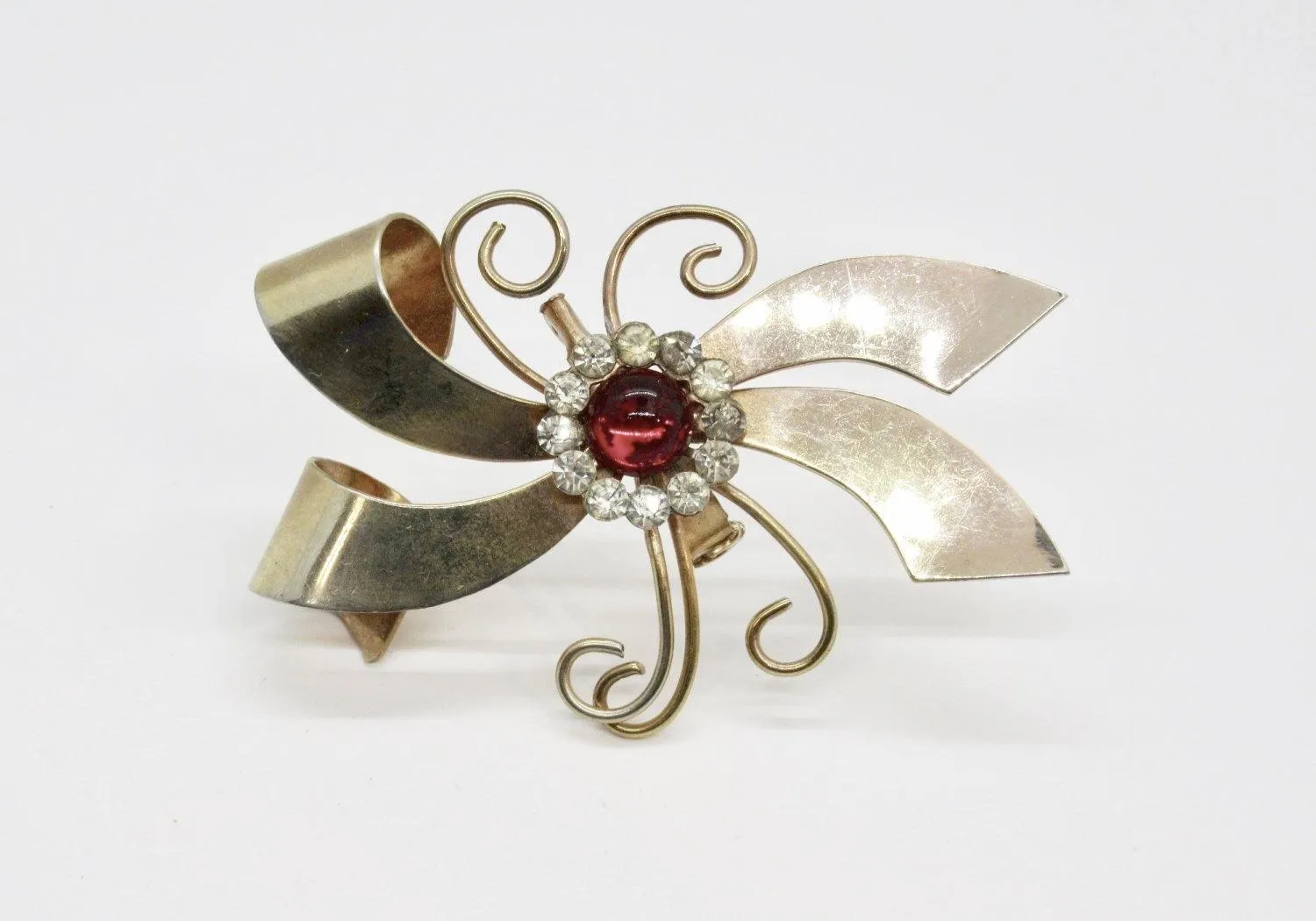 Vintage Abstract Bow Brooch with Red Cabochon and Bright Rhinestones