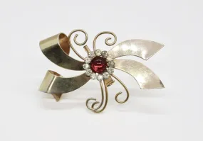 Vintage Abstract Bow Brooch with Red Cabochon and Bright Rhinestones